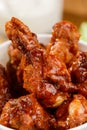 Macro on Buffalo drumsticks. Ruddy crust of succulent meat fried in hot sauce Royalty Free Stock Photo