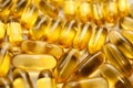 Macro of a bunch of yellow gel pills. Royalty Free Stock Photo