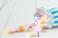 Macro of candy bag spilling heart shaped candies Royalty Free Stock Photo