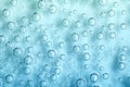 Macro Carbon dioxide CO2 bubbles in water on a blue background Royalty Free Stock Photo