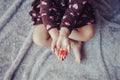 Macro of child with adult parent hands palms holding a bunch of small red and purple paper foam hearts Royalty Free Stock Photo