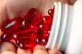 Macro of childs Hand full of medicines.