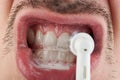 Macro of cleaning teeth Royalty Free Stock Photo