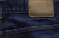 Macro, Close-up of blank leather label on new denim blue jeans trousers. Royalty Free Stock Photo