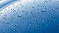 Macro close-up of clear water droplets on a smooth blue surface Royalty Free Stock Photo