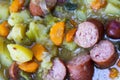 Macro close up of german hearty pea stew with potatoes, leek, carrots and smoked sausages - Germany