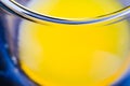 Macro close up a glass of fresh orange juice focus on glass border Royalty Free Stock Photo