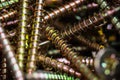 Macro close up of isolated pile metal crosshead screws in tool box