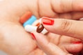 Macro Close up of medicinal or herbal  multi color tablet, capsule and pill on a female hand palm. Royalty Free Stock Photo