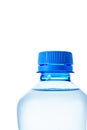 Macro close-up of the neck of blue plastic bottle with clean water horizontal position, isolate on white Royalty Free Stock Photo