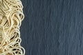 Macro close-up of noodles on stone slate background in horizontal Royalty Free Stock Photo