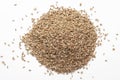 Macro close-up of Organic Ajwain seed Trachyspermum ammi or thymol seeds on white background. Pile of Indian Aromatic Spice. Royalty Free Stock Photo