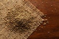 Macro close-up of Organic Ajwain seed Trachyspermum ammi or thymol seeds on the wooden top background and jute mat. Royalty Free Stock Photo