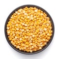 Macro Close-up of Organic Bengal Gram Cicer arietinum or split yellow chana dal on a ceramic black bowl. Royalty Free Stock Photo