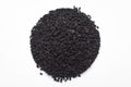 Macro close-up of Organic black cumin Nigella sativa or kalonji on white background. Pile of Indian Aromatic Spice.