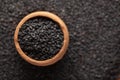 Macro Close-Up of Organic Black Sesame seeds Sesamum indicum or Black Til with shell in an earthen clay pot kulhar