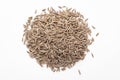 Macro close-up of Organic cumin seed Cuminum cyminum or jeera on white background. Pile of Indian Aromatic Spice. Royalty Free Stock Photo
