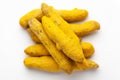 Macro close-up of Organic dry turmeric root Curcuma longa on white background. Pile of Indian Aromatic Spice. Royalty Free Stock Photo