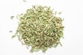 Macro close-up of Organic Fennel Seeds Foeniculum vulgare Badi sonf on white background. Pile of Indian Aromatic Spice.