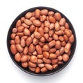 Macro Close up of organic red brown peanuts Arachis hypogaea on a black Ceramic bowl, Royalty Free Stock Photo