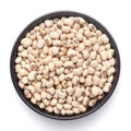 Macro Close-up of Organic soybean, Glycine max or soya bean dal on a ceramic black bowl.