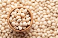 Macro Close up of Organic soybean, Glycine max or soya bean dal in an earthen clay pot kulhar on the self background.