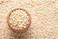 Macro Close up of Organic split polished white urad dal Vigna mungo in an earthen clay pot kulhar on the self background.