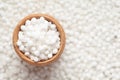 Macro close-up organic white sago or sabudana big size in an earthen clay pot kulhar on the self background.