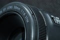 Macro close-up photo of lens to DSLR camera on dark background front view with focal range and aputure description Royalty Free Stock Photo