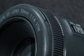 Macro close-up photo of lens to DSLR camera on dark background front view with focal range and aputure description Royalty Free Stock Photo