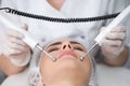 Macro close up portrait of woman having cosmetic galvanic beauty treatment in spa.Therapist applying low frequency