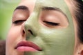Facial beauty seaweed treatment on young woman
