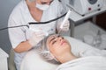 Macro close up portrait of woman having cosmetic galvanic beauty treatment in spa.Therapist applying low frequency Royalty Free Stock Photo