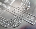 Macro close up of a pure Silver Bullion coin with a Bitcoin icon Royalty Free Stock Photo