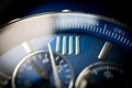 Macro Close Up of Roman Numeral Four on Blue Faced Chronograph Watch Royalty Free Stock Photo