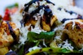 Macro close up of salad with fried turkey breast, tomatoes, green corn lettuce, fresh grated pecorino cheese and brown balsamic Royalty Free Stock Photo