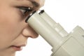 Macro Close Up Shot of a Female Scientist Looking into the Microscope. Side View Royalty Free Stock Photo