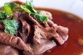 Macro close up shot of Pork stewed in the gravy with green coriander leaves