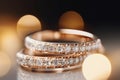 Macro close up of two perfect wedding rings with amazing ivory diamonds in a jewelry shop. Royalty Free Stock Photo