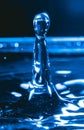 Close up of a water drop falling and impacting on a body of water