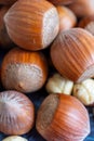 Macro close-up of whole and peeled hazelnuts