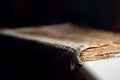 Macro closed old antique bible book with sticky cover on a dark background close-up Royalty Free Stock Photo