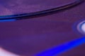 Macro closeup of Compact CD or DVD disc in violet color Royalty Free Stock Photo