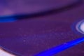 Macro closeup of Compact CD or DVD disc in violet color Royalty Free Stock Photo