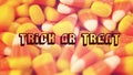 Macro closeup of Halloween traditional Candy Corn treats retro filter with text. Royalty Free Stock Photo