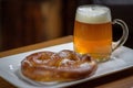 Closeup of a large glass mug of beer and a soft pretzel Royalty Free Stock Photo