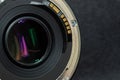 Macro closeup photo of lens to DSLR camera on dark background view of contacts connecting communication with camera