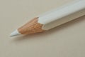Macro closeup of sharpened white wooden colored pencil tip on light background Royalty Free Stock Photo