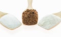 Macro Coffee powder and creamer with sugar cubes on wooden spoon Royalty Free Stock Photo