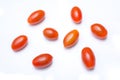 Macro Of A Collection Of Five Red Datterino Plum Tomatoes
